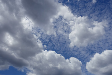  white clouds on sunny blue sky in summer day background
