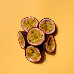 Creative layout made of passion fruit. Flat lay. Food concept. Colorful fruit pattern.
