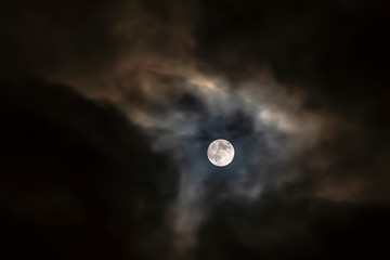 Moon flying through the clouds