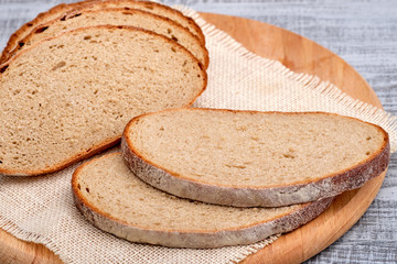Fresh sliced bread on cutting board