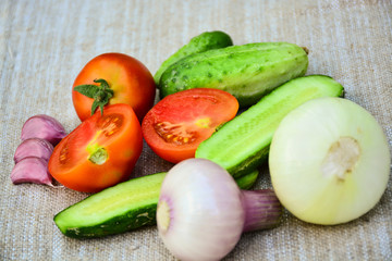 Fresh vegetables. Tomatoes, cucumbers, garlic, onions.	