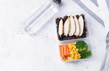 Fresh healthy diet lunch box with vegetable salad on table background with free text space for diet menu.