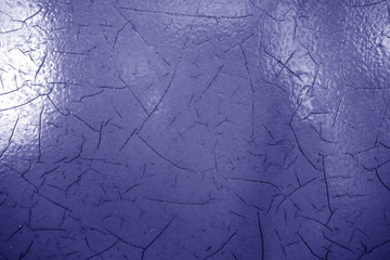 Cracked paint texture in blue color.