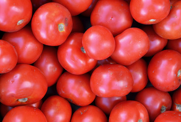 Fresh tomatoes vegetables at a farmers market. Background