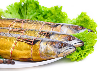 Smoked fish on plate close up