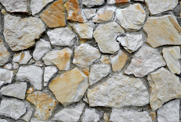 Background of bright stone wall mosaic texture