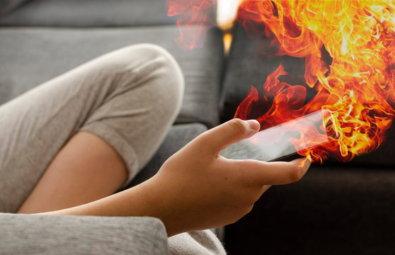 Cell Phone On Fire. Teen Using The Cell Phone. Text, Messages, Internet Games.