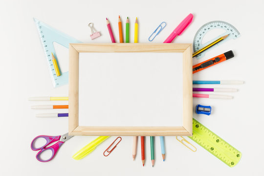 Wooden frame surrounded by school accessories