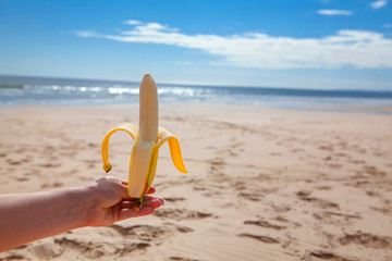 banana in hand on the beach