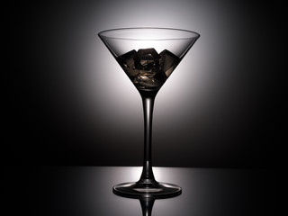 empty martini glass on black background