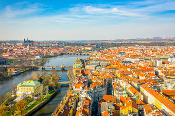 Obraz premium Aerial Panoramic View of Prague City above the River, Bridges and Old Town at Sunset Time