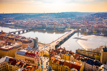 Aerial Panoramic View of Prague City above the River, Bridges and Old Town at Sunset Time