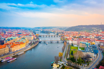 Obraz premium Aerial Panoramic View over The Prague City at Sunset Time, River, Bridges, Castle and Old Town, Czech Republic