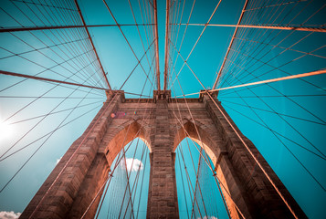 Structural detail of the Brooklyn Bridge with blue sky background