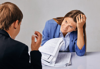 portrait of two people. Problems in their business relationships.