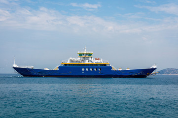 Fototapeta na wymiar Ferry on the sea transports cars and travelers