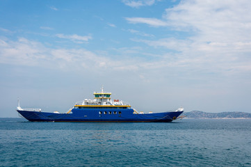 Ferry on the sea transports cars and travelers