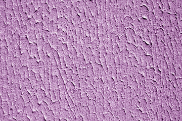 Plaster wall texture with interesting pattern in purple color.