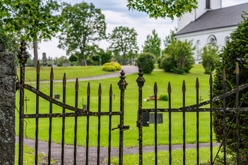 Old metal entrance gate to an old cemetery in Sweden