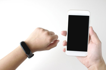 Closeup of a smart digital wristwatch on a wrist. Women are ready to hold a mobile phone. isolated on white background, top view.