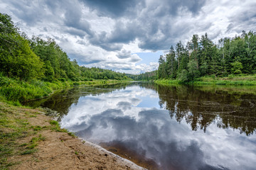 Naklejka na ściany i meble open view to the river of Gauja in Latvia with cloud reflections in water