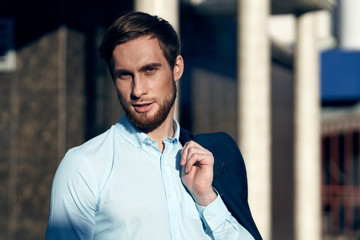 portrait of a young man with arms crossed