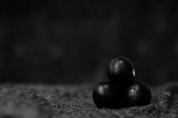 black and white still life,with black berries and fruits