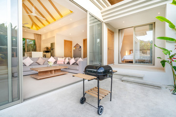 Fototapeta na wymiar Interior and exterior design in bedroom of pool villa