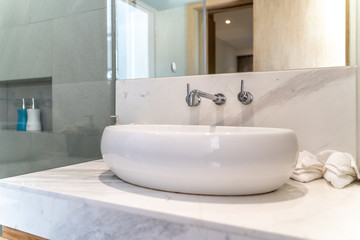 Luxury bathroom features basin, toilet in the house or home building