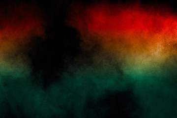 Obraz na płótnie Canvas Red Green color powder explosion on black background.