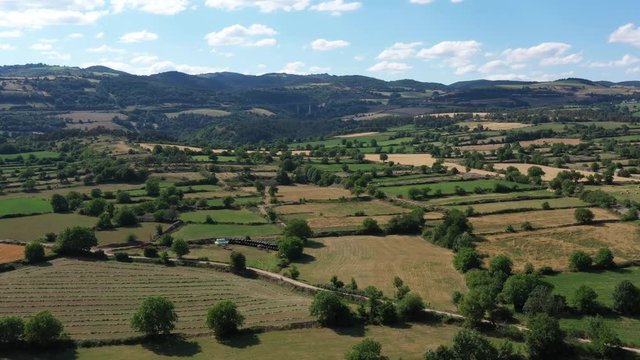 Flying over bocage Aveyron France sunny day Marvejols Massif Central