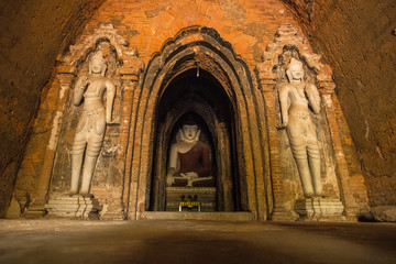 A buddha sculpted in stone inside a beautiful temple in Bagan, Myanmar. © unai