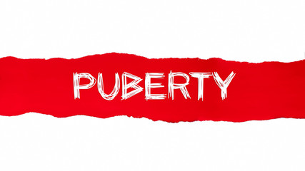 The text PUBERTY written under the curled piece of Red torn paper