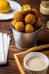 Delicious and healthy falafel with tahini sauce close-up