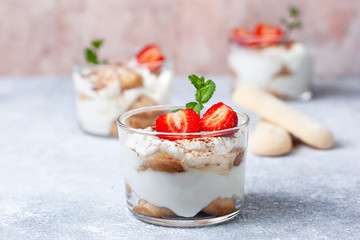 tiramisu in a glass with fresh strawberries