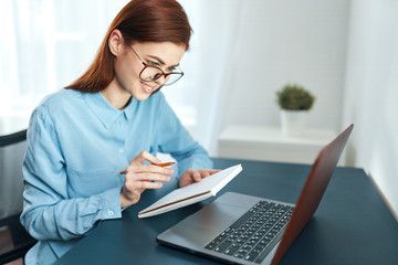 young woman working on laptop in office