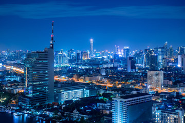 Fototapeta premium Beautiful scene of Bangkok city skyscraper at night in downtown and business district.