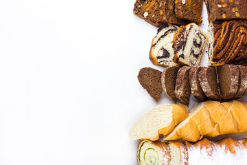 Various kinds of fresh bread, cake, homemade pastry on white isolated background. Food, vegetarian healthy food concept
