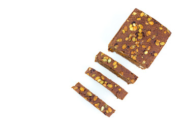 Bread with nuts and dried fruits, prunes, dried apricots, raisins and seeds on isolated white background