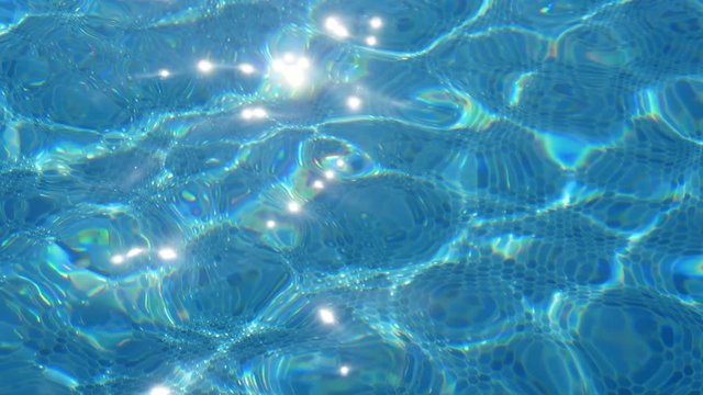 Riveting cyan waves in a see-through wading pool in Alanya in summer in slo-mo  