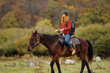 young woman riding horse