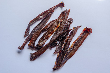 Roasted pork kidneys. Traditional national snack. Shooting overthrow down. Macro. White background.