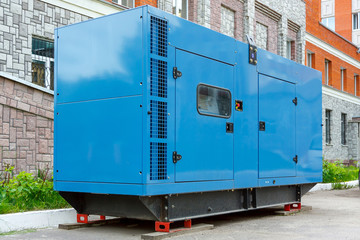 Diesel generator for emergency power supply at the wall of the medical center in good weather - obrazy, fototapety, plakaty