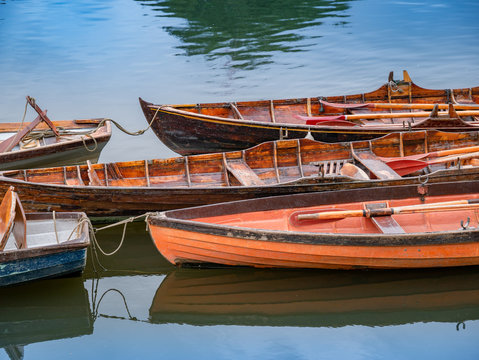 Vintage wooden boats on the Thames rive in London in a sunny day