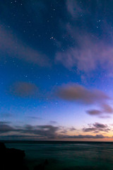 Fototapeta na wymiar 来間島で夕日に染まる空と輝き始める星々たち