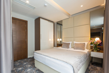 Interior of a luxury hotel double bed bedroom