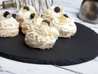 baked round meringues with whipped cream