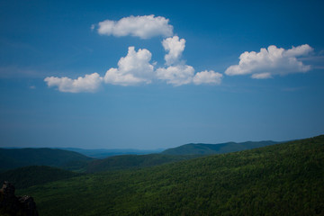 view of the Ural mountains in sunny weather from the mountain