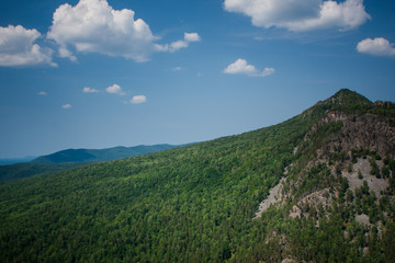 view of the Ural mountains in sunny weather from the mountain