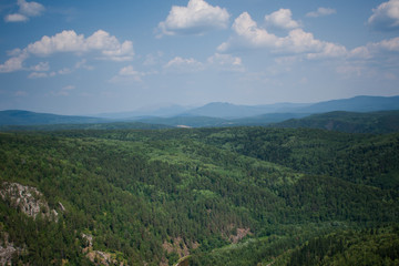 Fototapeta premium view of the Ural mountains in sunny weather from the mountain